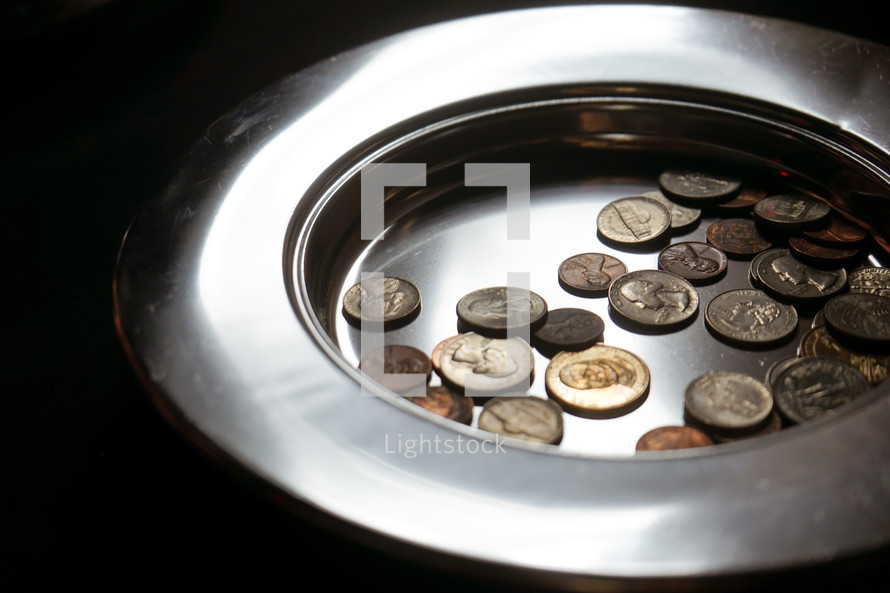 coins in an offering plate 