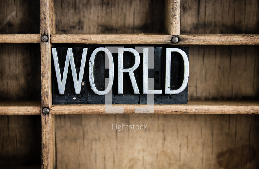 word world in blocks on a bookshelf 