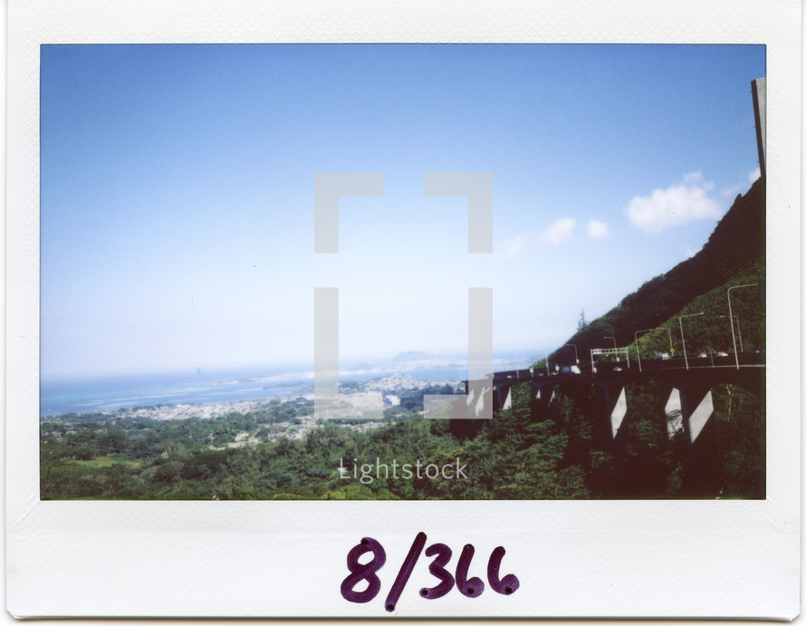 Polaroid of a mountainside road 