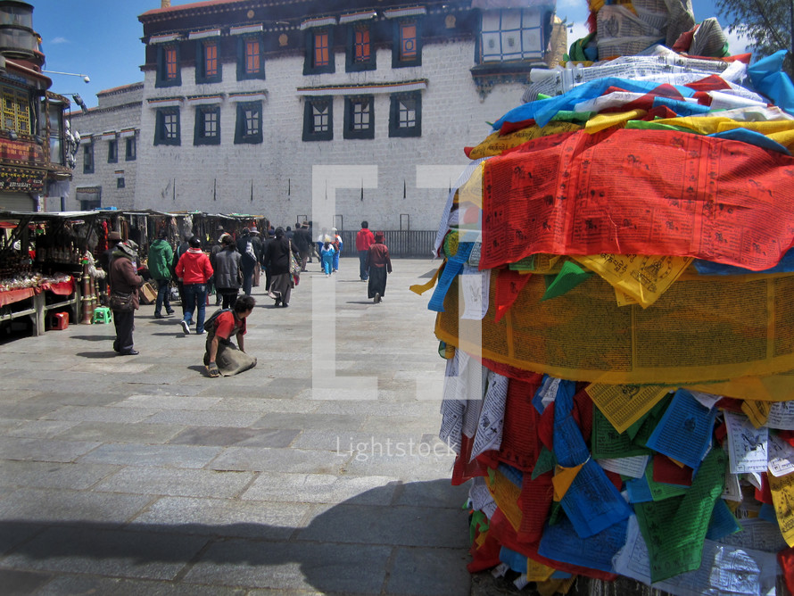 pole wrapped in cloth prayer flags