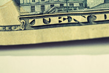 A closeup of a ten dollar bill