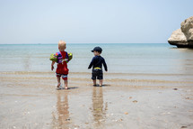 Kids playing on a beach in Muscat, Oman