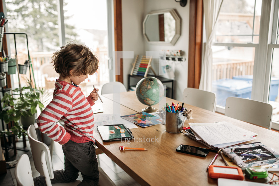 a kid doing school work at home 
