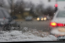 melting snow on a car window 
