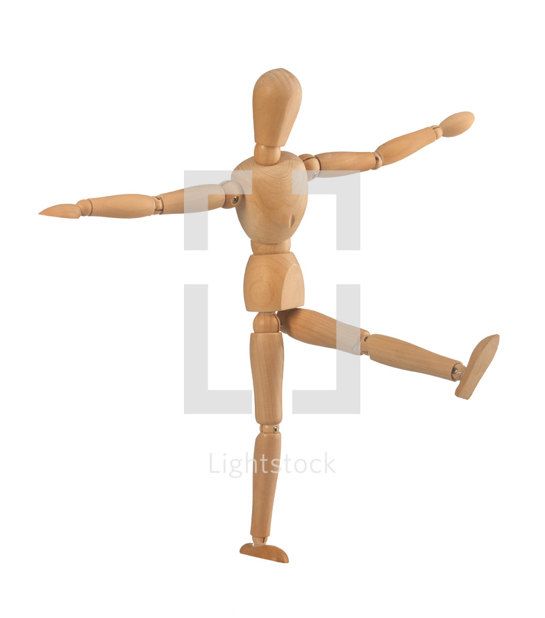 Wooden dummy in the balance on white background