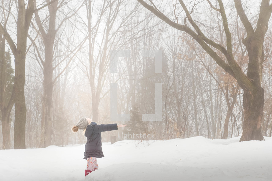 a child playing in snow 