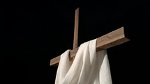 white shroud on a cross a night 