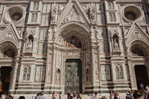 people gathered in front of a cathedral in Italy 