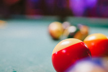 Pool balls on a pool table.