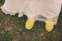 Woman with white dress and yellow rain boots