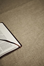 The corner of an open bible
