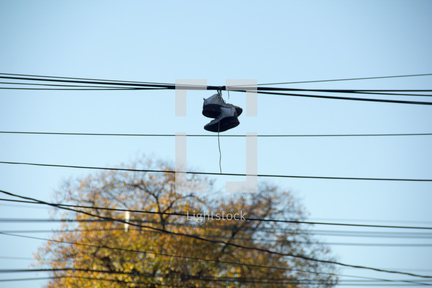 shoes hanging from power lines 