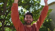 Boy Raises His Hands Up And Dance With Smile In His Countryside