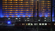 Timelapse of commuter train in the city at night