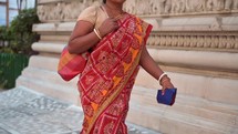 Hindu woman walking to the Birla Mandir Hindu temple in Kolkata, India.