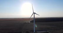 Drone Aerial View Of Wind turbineOn A Sunny Day. 