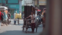 Cars and people on the streets of Kolkata India