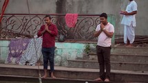 Hindu worshipers praying at the watering pool at the Taraknath Temple in Kolkata, India.