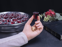 Communion glass cups on tray filled with wine, the symbol of Jesus Christ blood.