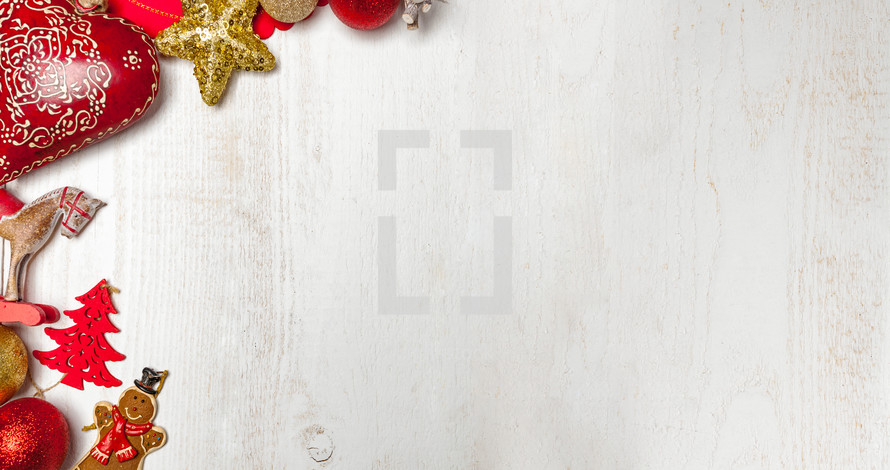 Christmas ornaments on white wood background 