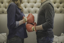 couple wearing boxing gloves 