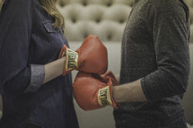 boxing couple touching gloves