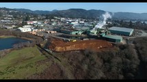 Aerial Video of Lumber Mill and Coastal Town