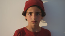 Portrait of a Young Boy in Red