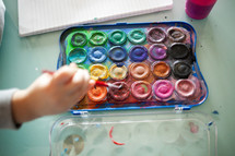 child painting with watercolors 