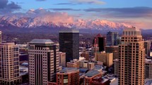 Aerial view of salt lake city skyline sunset view glow Salt Lake City skyline 4k Drone shot with the Wasatch Mountain in the background	