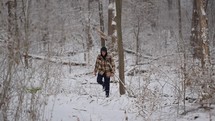 Man walking in snowy woods