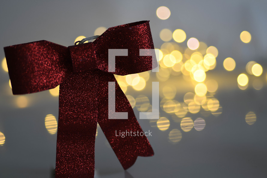 red bow and white bokeh lights 
