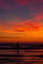 surfer girl under a vibrant sunset 