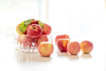 bowl of apples in natural light, backlit