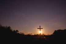 sunset behind a cross