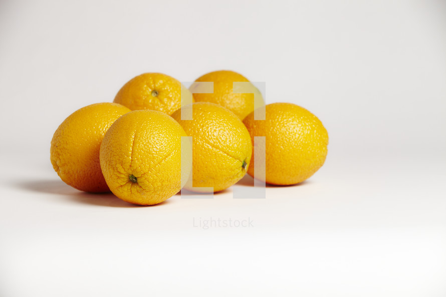A cluster of oranges isolated on white