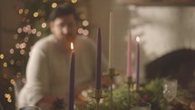 Man lighting advent candles 