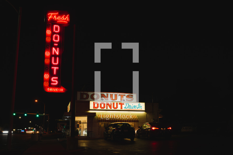 donuts sign at night 