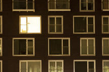 Single lit window in a modern apartment