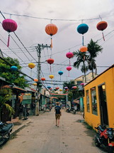 paper lanterns over a street 