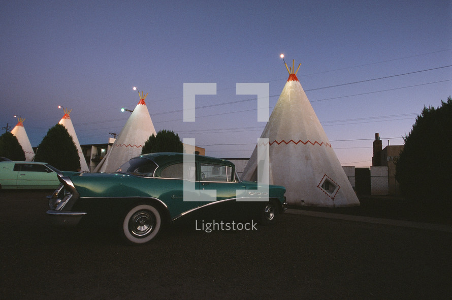 vintage cars and tepee motel rooms