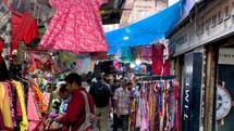 Walking through a busy street market in Kolkata, India.
