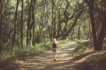 woman hiking on a nature trail 