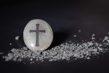 cross, stone, and ashes 
