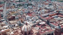 aerial view over a church and city in Mexico 