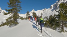Ski touring in alps mountains nature in beautiful sunny day with blue sky
