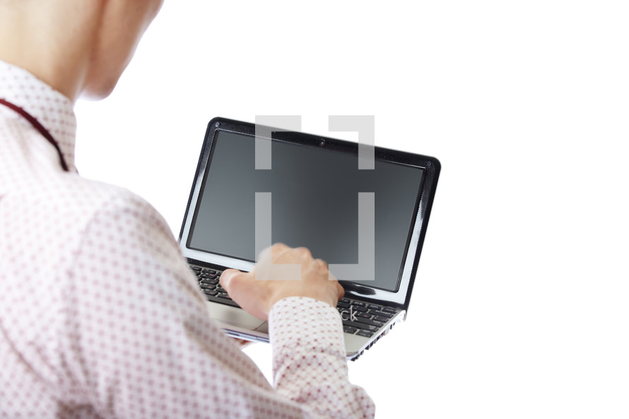 a businessman holding a laptop computer 