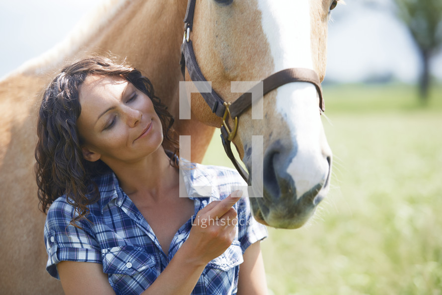 a woman with her horse 