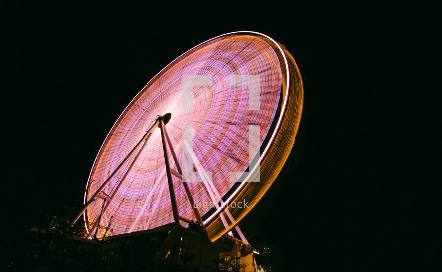 lights from an amusement park ride 