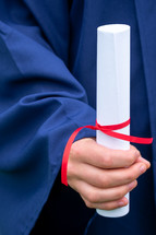graduate holding a diploma 